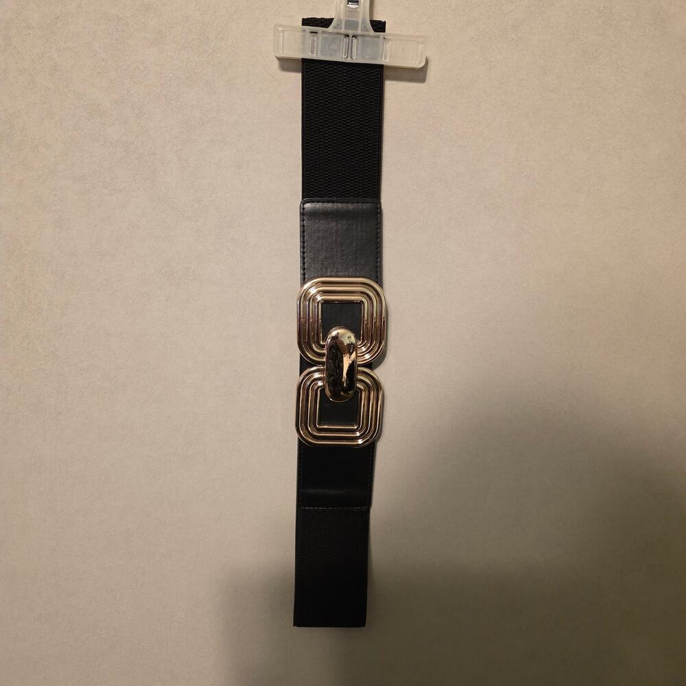 Black elastic wide waist belt with decorative interlocking gold metal buckle